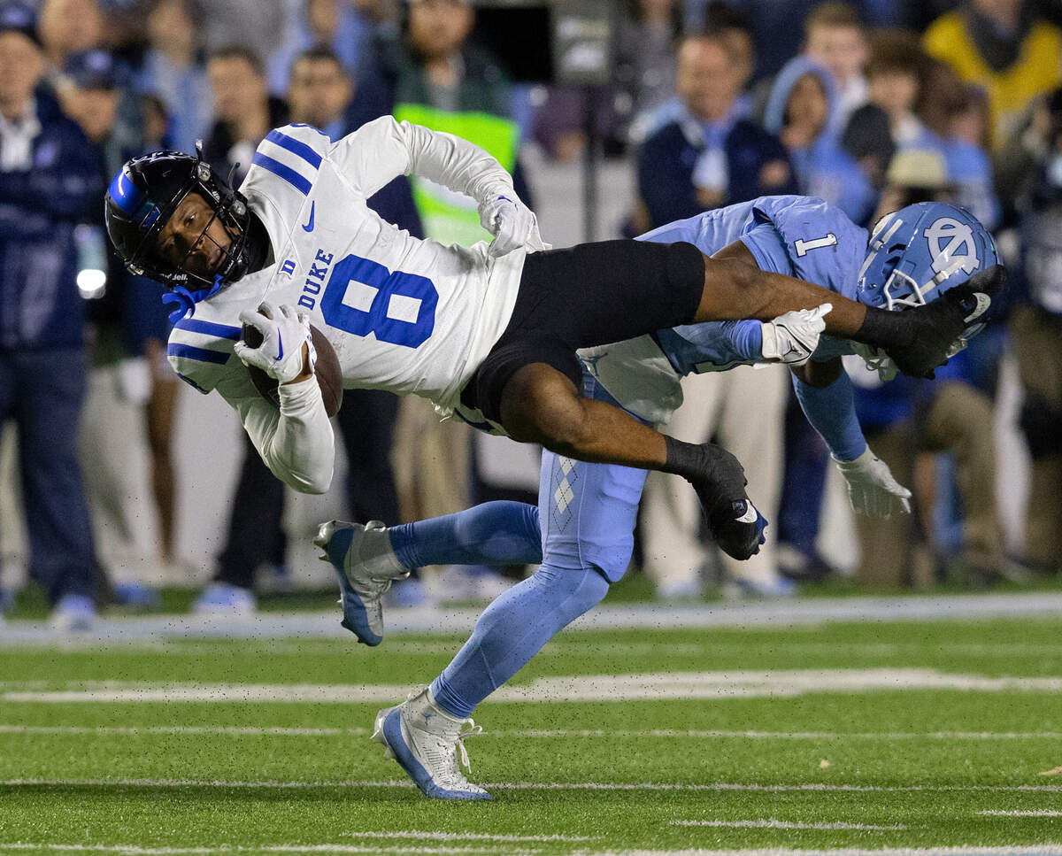 Duke’s Jordan Moore is taken down by North Carolina’s Antavious Lane during the second half of the Blue Devils’ 47-45 loss on Saturday, Nov. 11, 2023, at Kenan Stadium in Chapel Hill, N.C.