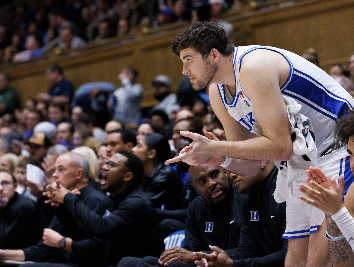 Duke’s Ryan Young applauds from the bench during the second half of the Blue Devils’ 95-66 win over La Salle on Tuesday, Nov. 21, 2023, at Cameron Indoor Stadium in Durham, N.C.