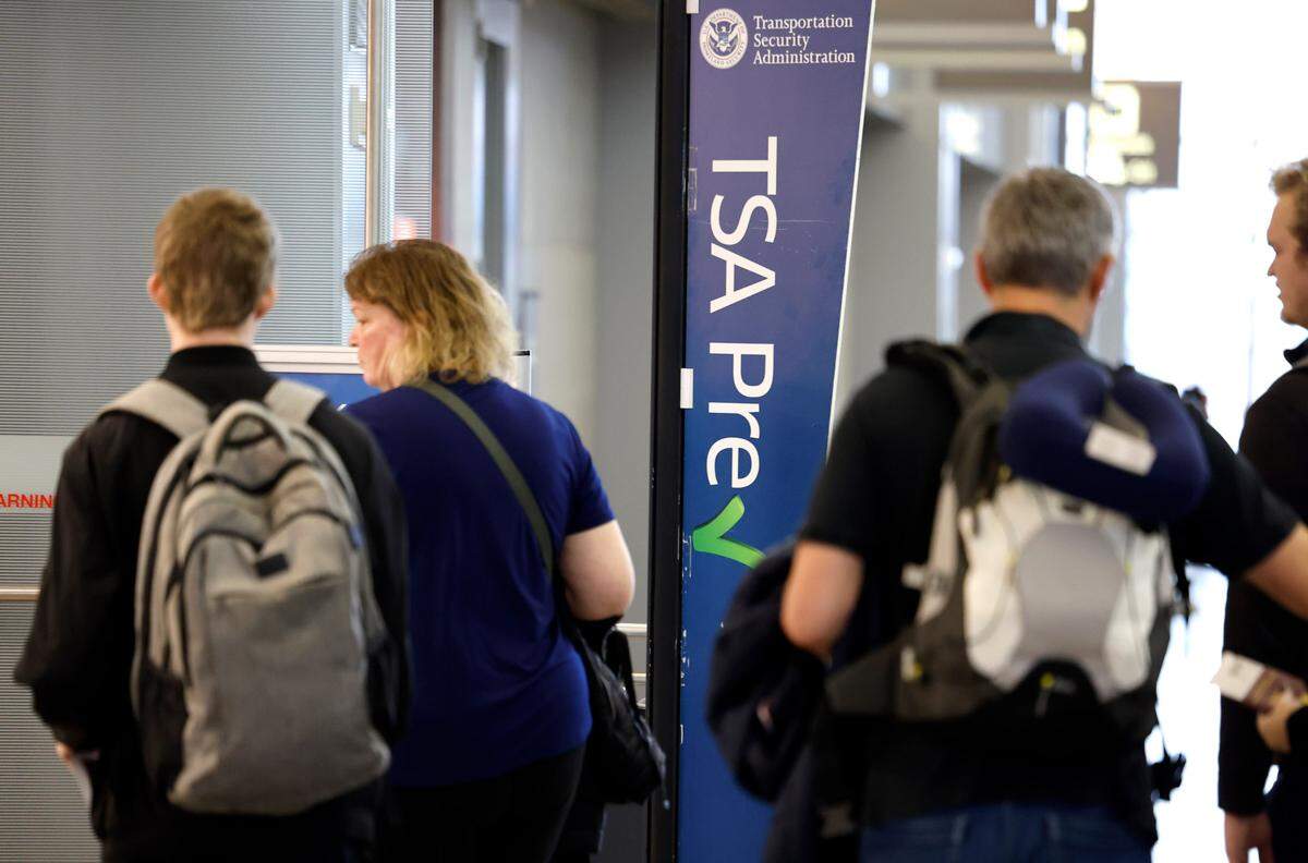 Passengers enter the TSA PreCheck checkpoint at Raleigh-Durham International Airport in Morrisville, N.C., Friday, May 17, 2024.