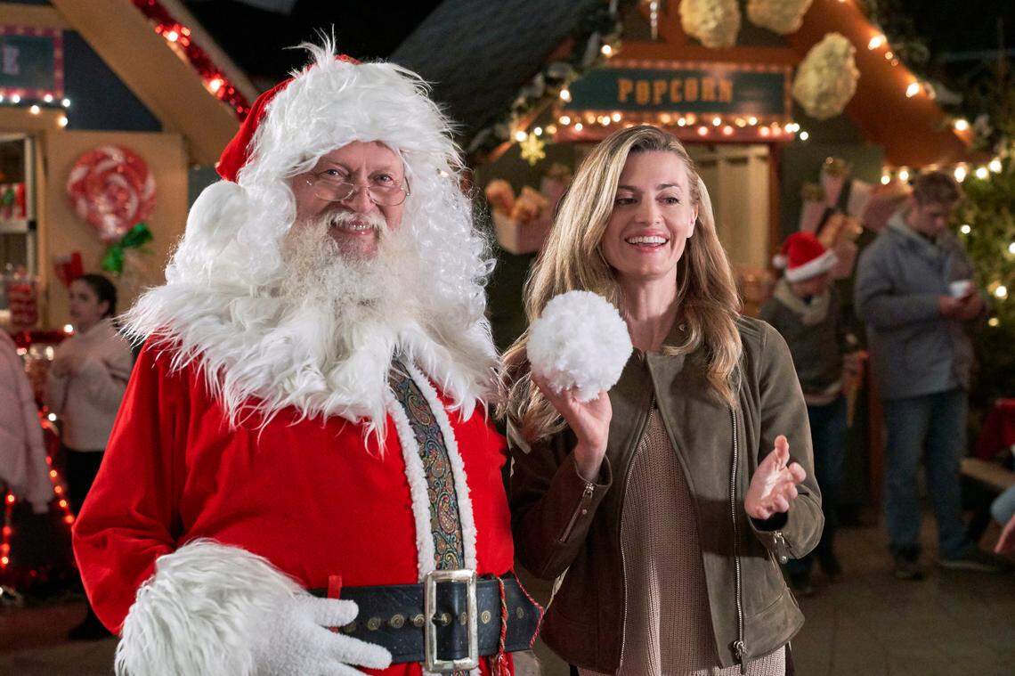 Brooke D’Orsay, right, with Santa in the Hallmark Movies & Mysteries movie “Nostalgic Christmas.”