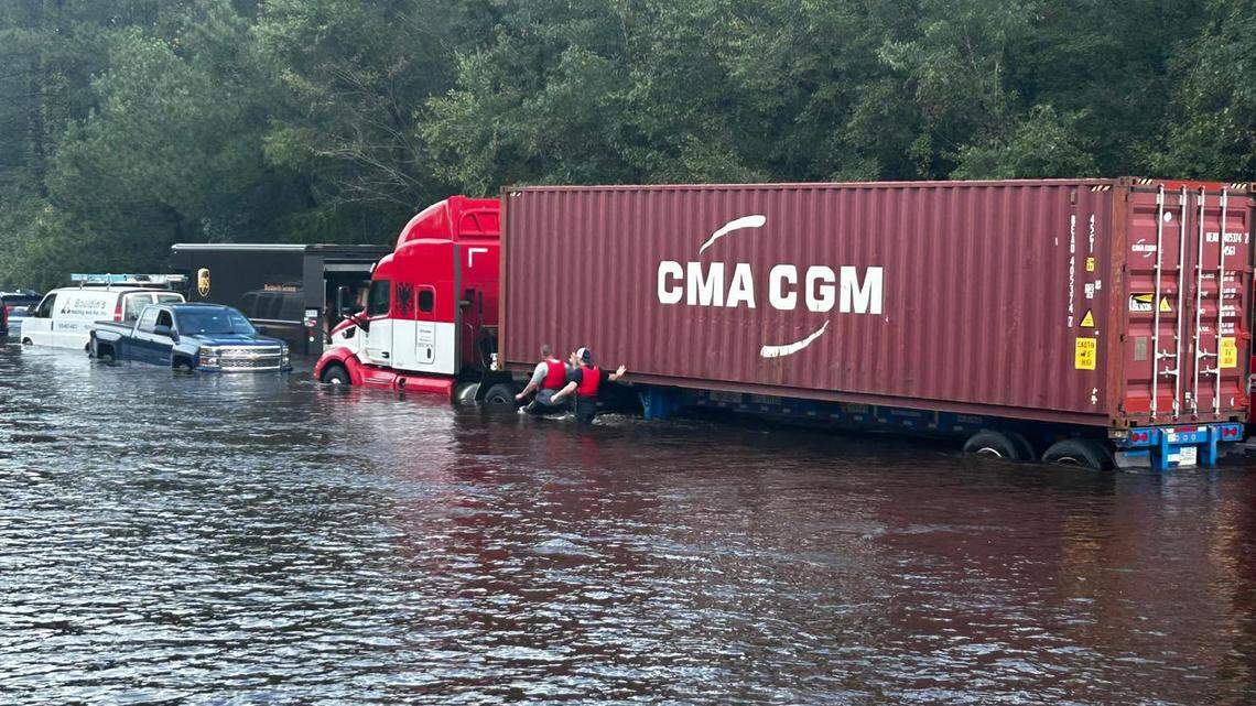 First responders rescue the occupants of several vehicles stranded in floodwaters on US 17 near NC 87 in Brunswick County, NC, Monday, Sept. 16, 2024