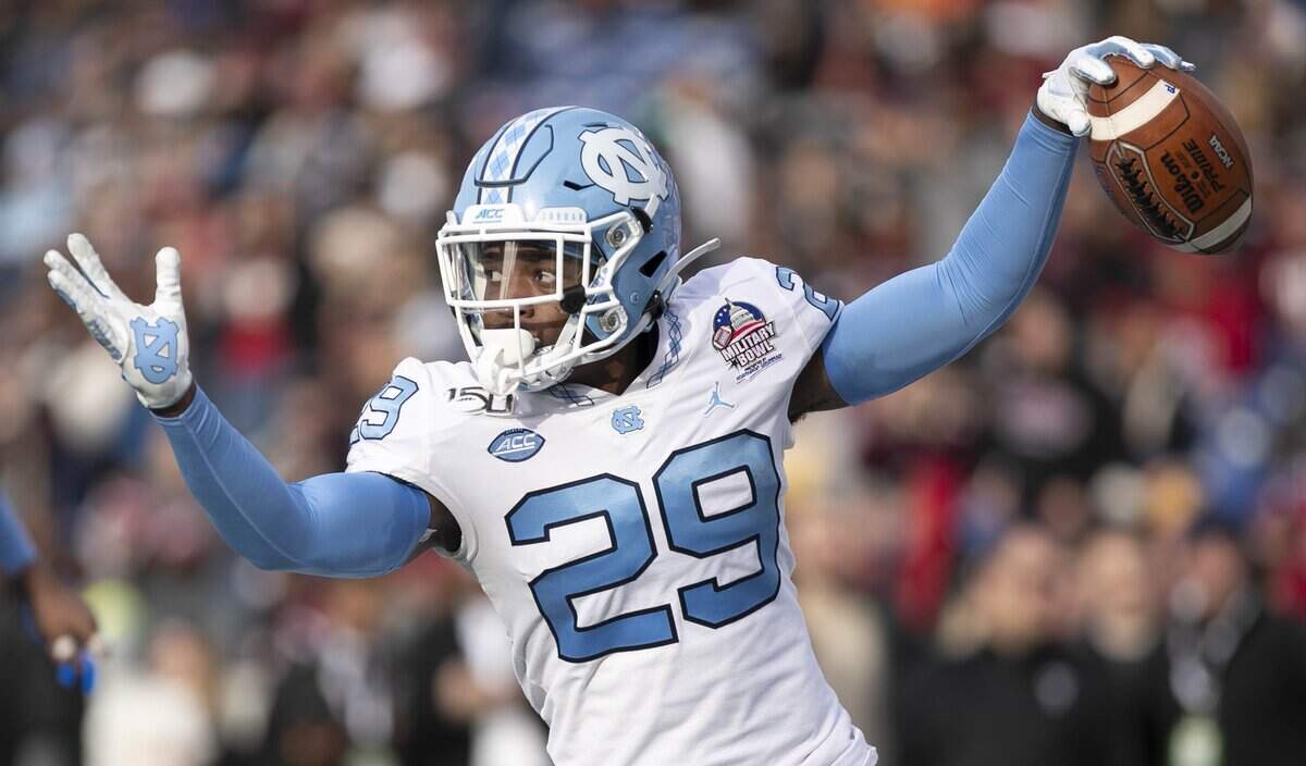 North Carolina’s Storm Duck returns an interception of Temple quarterback Anthony Russo 20 yards for a touchdown to give the Tar Heels’ a 34-6 lead in the third quarter during the Military Bowl on Friday, Dec. 27, 2019 at Navy-Marine Corps Memorial Stadium in Annapolis, Maryland.