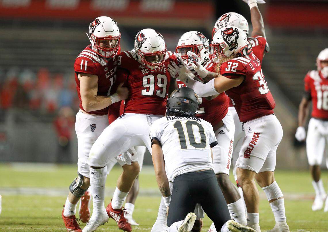 N.C. State’s Daniel Joseph celebrates with teammates after sacking Wake Forest quarterback Sam Hartman (10) during the second half of N.C. State’s 45-42 victory over Wake Forest at Carter-Finley Stadium in Raleigh, N.C, Saturday, Sept. 19, 2020.