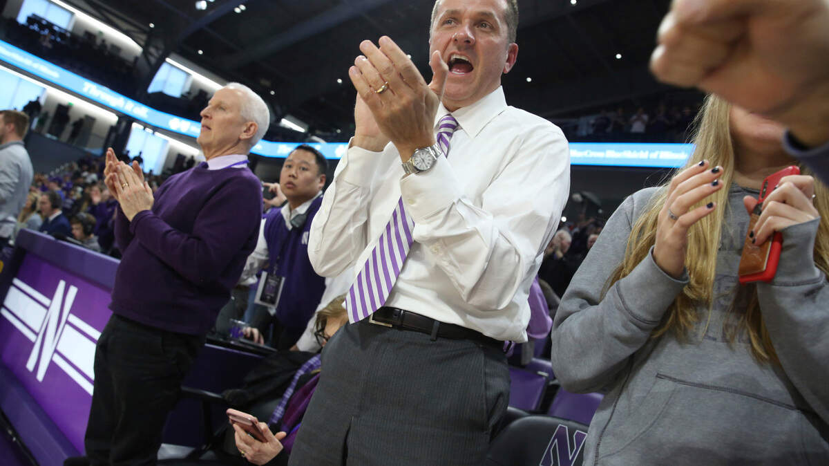 Northwestern University Athletic Director Jim Phillips celebrates as the Northwestern women’s basketball team beats Illinois 75-58 to win at least a share of the Big Ten Conference Championship at Welsh-Ryan Arena Saturday, Feb. 29, 2020, in Evanston, Ill.