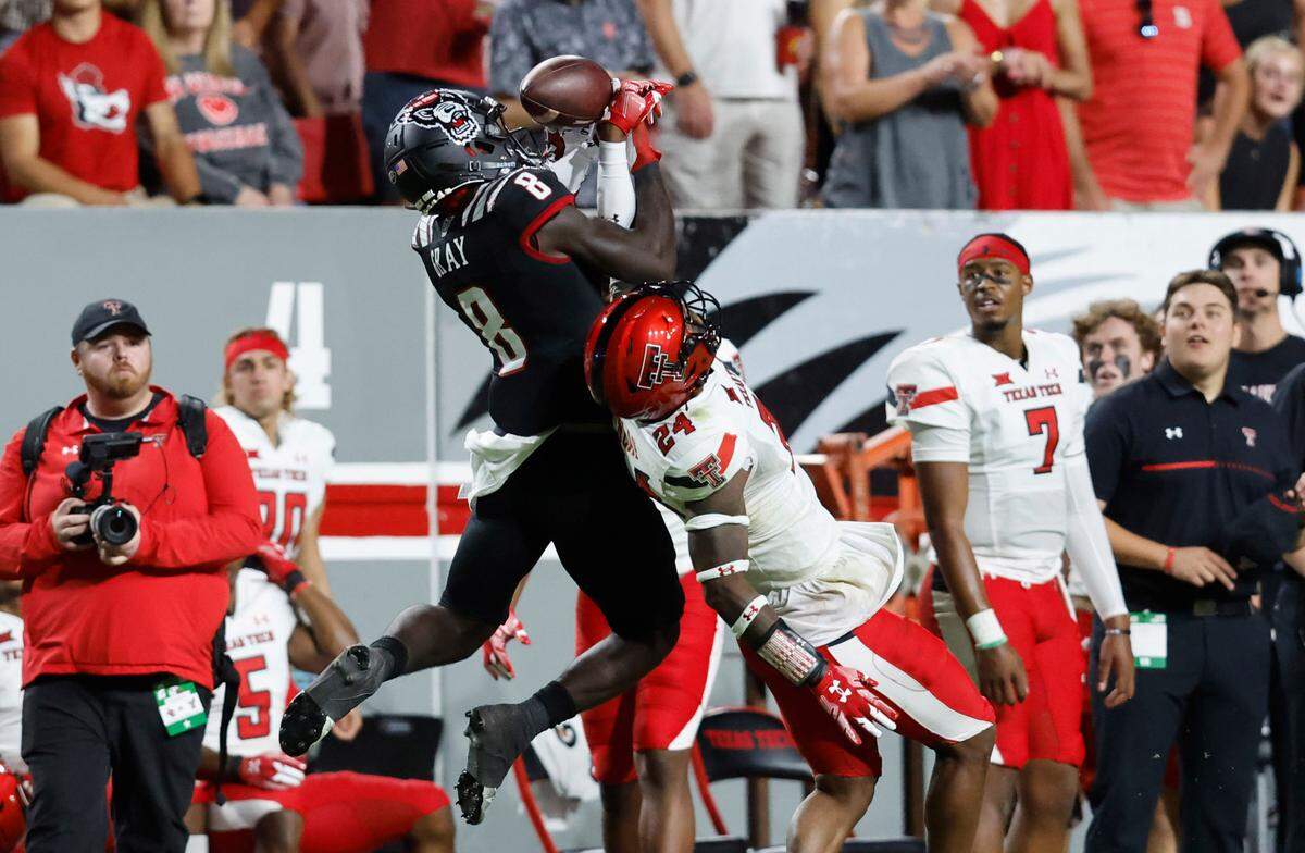 Texas Tech defensive back Malik Dunlap (24) breaks up a pass intended for N.C. State wide receiver Julian Gray (8) during the first half of N.C. State’s game against Texas Tech at Carter-Finley Stadium in Raleigh, N.C., Saturday, Sept. 17, 2022.