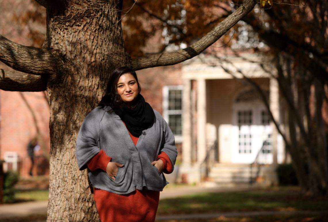 Glenda Polanco outside of Martin Hall, the building where she works at Meredith College in Raleigh, on Friday, Dec. 18, 2020.