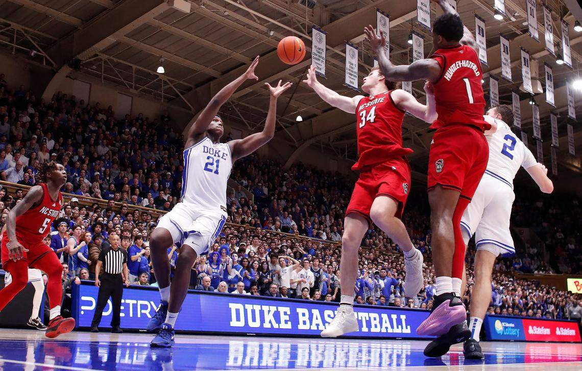Duke’s Cooper Flagg (2) passes to an open Patrick Ngongba II (21) for two to put the Blue Devils up by six with 1:26 left in Duke’s 74-64 victory over N.C. State at Cameron Indoor Stadium in Durham, N.C., Monday, Jan. 27, 2025.