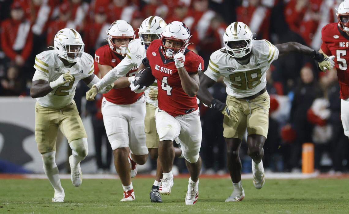 N.C. State’s Duke Scott (4) scrambles for a 69-yard rush during the second half of N.C. State’s 48-36 victory over Georgia Tech at Carter-Finley Stadium in Raleigh, N.C., Saturday, Nov. 1, 2025.