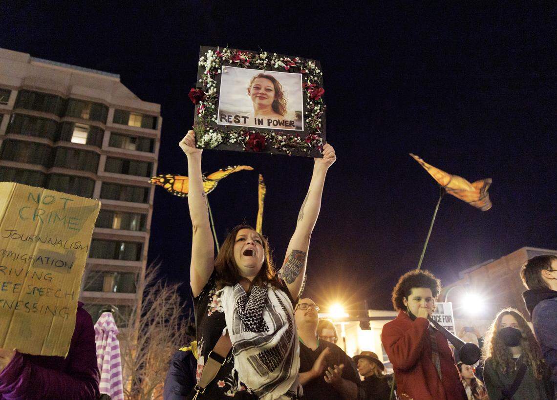 Susan Hudson holds a photograph of Renee Nicole Good while gathering with other demonstrators during a protest in downtown Durham on Thursday, Jan. 8, 2026. Good, 37, was shot and killed by an ICE agent in Minneapolis on Wednesday. 