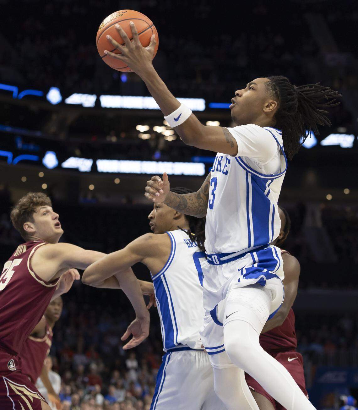 Duke forward Isaiah Evans (3) drives to the basket off a screen by Maliq Brown (6) in the first half against Florida State on Thursday, March 12, 2026, during the quarterfinals of the ACC Tournament at Spectrum Center in Charlotte, N.C.