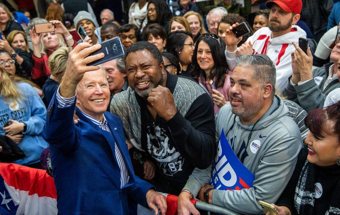 Former Vice President Joe Biden poses for photographs with supporters during a campaign rally at St. Augustine’s University, a private HBCU, Saturday, Feb. 29, 2020 before Super Tuesday.