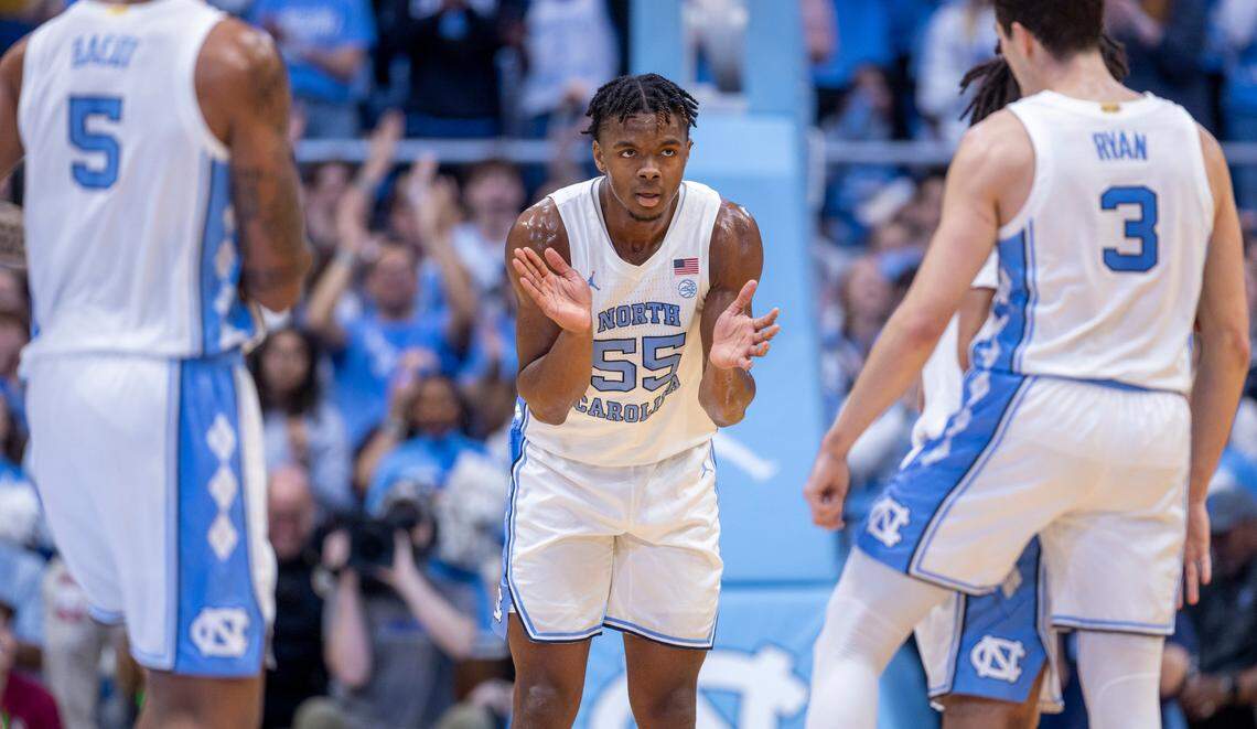 North Carolina’s Harrison Ingram (55) applauds his teammates after a score on a fast break against Florida State in the first half on Saturday, December 2, 2023 at the Smith Center in Chapel Hill, N.C.