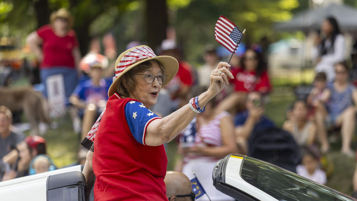 North Carolina Sec. of State Elaine Marshall, waves her flag during the First in Freedom Parade on Saturday, July 4, 2026 in Raleigh, N.C. 