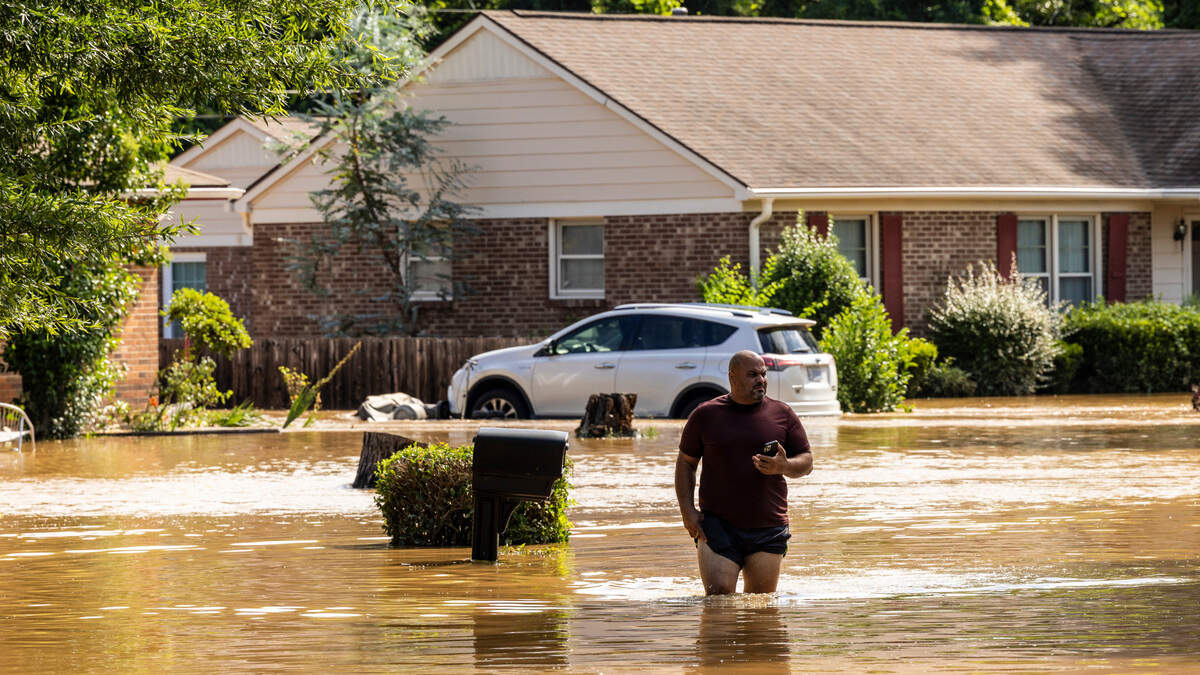 Ahmed Abdelnasser of Durham’s Old Farm neighborhood asses flood damage near his home near the Eno River in Durham on Monday morning, July 7, 2025 after Tropical Storm Chantal’s rains caused flash flooding.