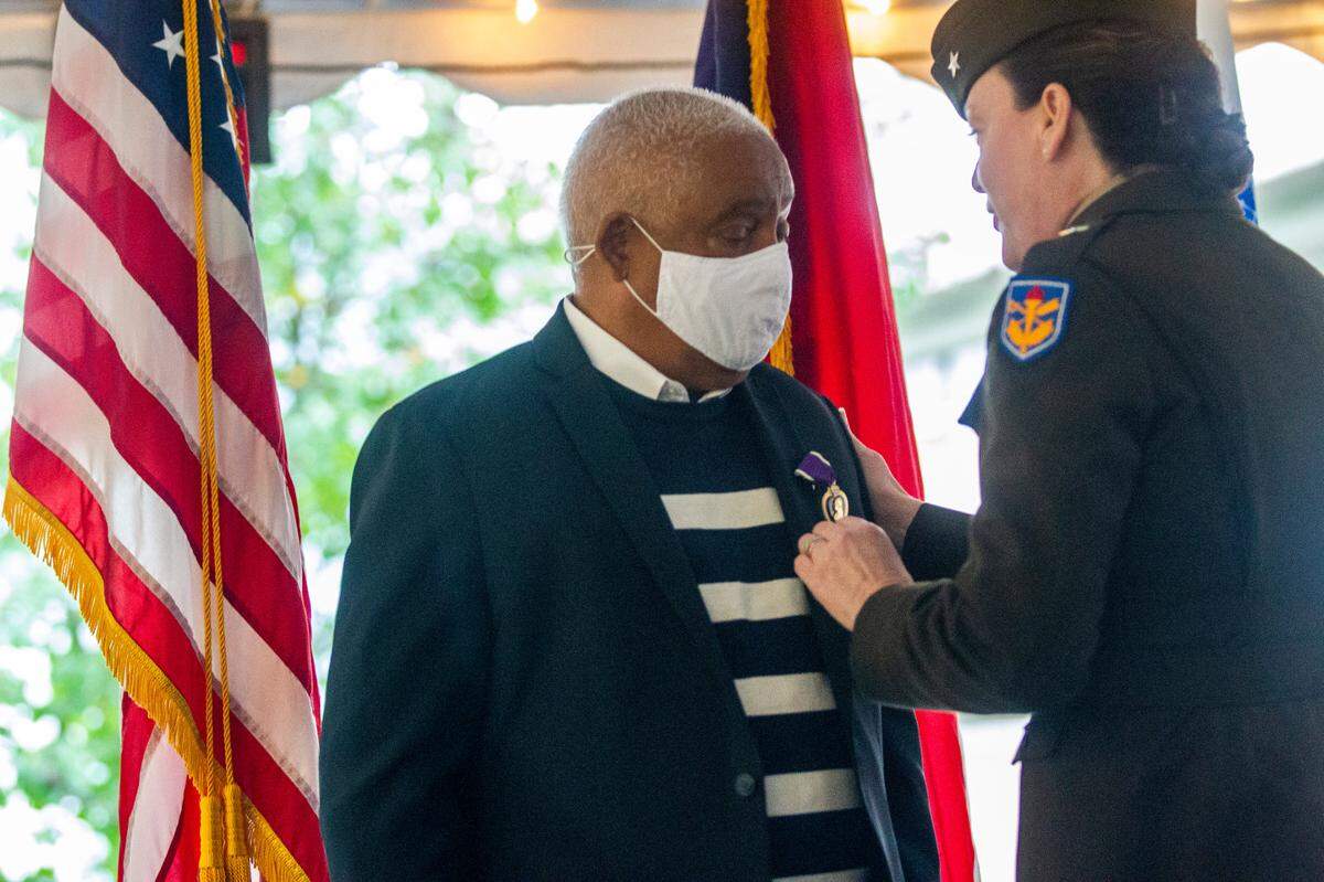 John Spencer Jr., a Vietnam War veteran was granted full federal veteran status with full health care benefits. He received a Purple Heart, combat infantryman badge and a Vietnam Gallantry Cross doing a ceremony at UNC-Chapel Hill Thursday, Nov. 4, 2021. A professor and students with the UNC School of Law’s Military and Veterans Law Clinic helped restore the veteran status and benefits Spencer deserved.