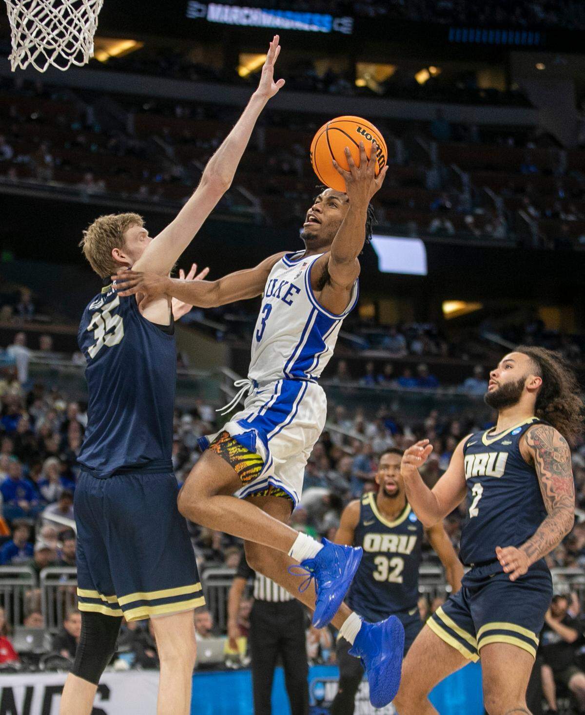 Duke’s Jeremy Roach (3) drives to the basket against Oral Roberts’ Connor Vanover (35) in the second half during the first round of the NCAA Tournament on Thursday, March 16, 2023 at the Amway Center in Orlando, Fla. Roach lead all scores with 23 points in the Blue Devils’ 74-51 victory.