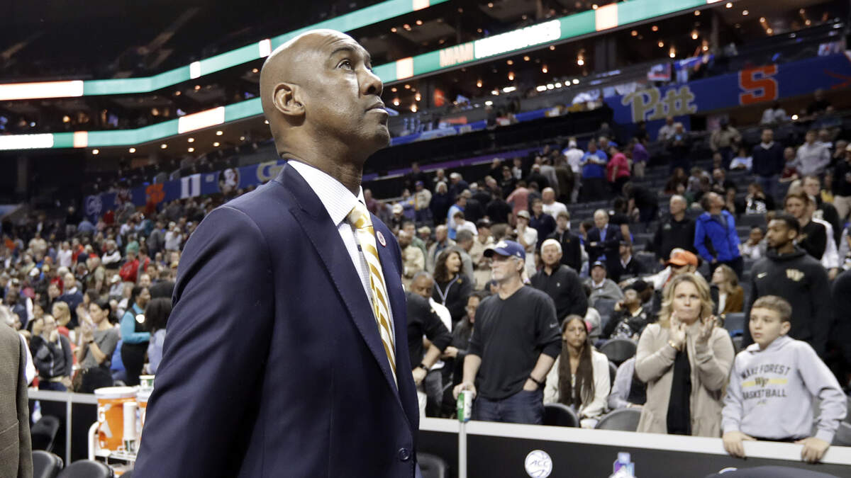 Wake Forest head coach Danny Manning, right, walks off the court after his team lost to Miami in an NCAA college basketball game in the Atlantic Coast Conference tournament in Charlotte, N.C., Tuesday, March 12, 2019.