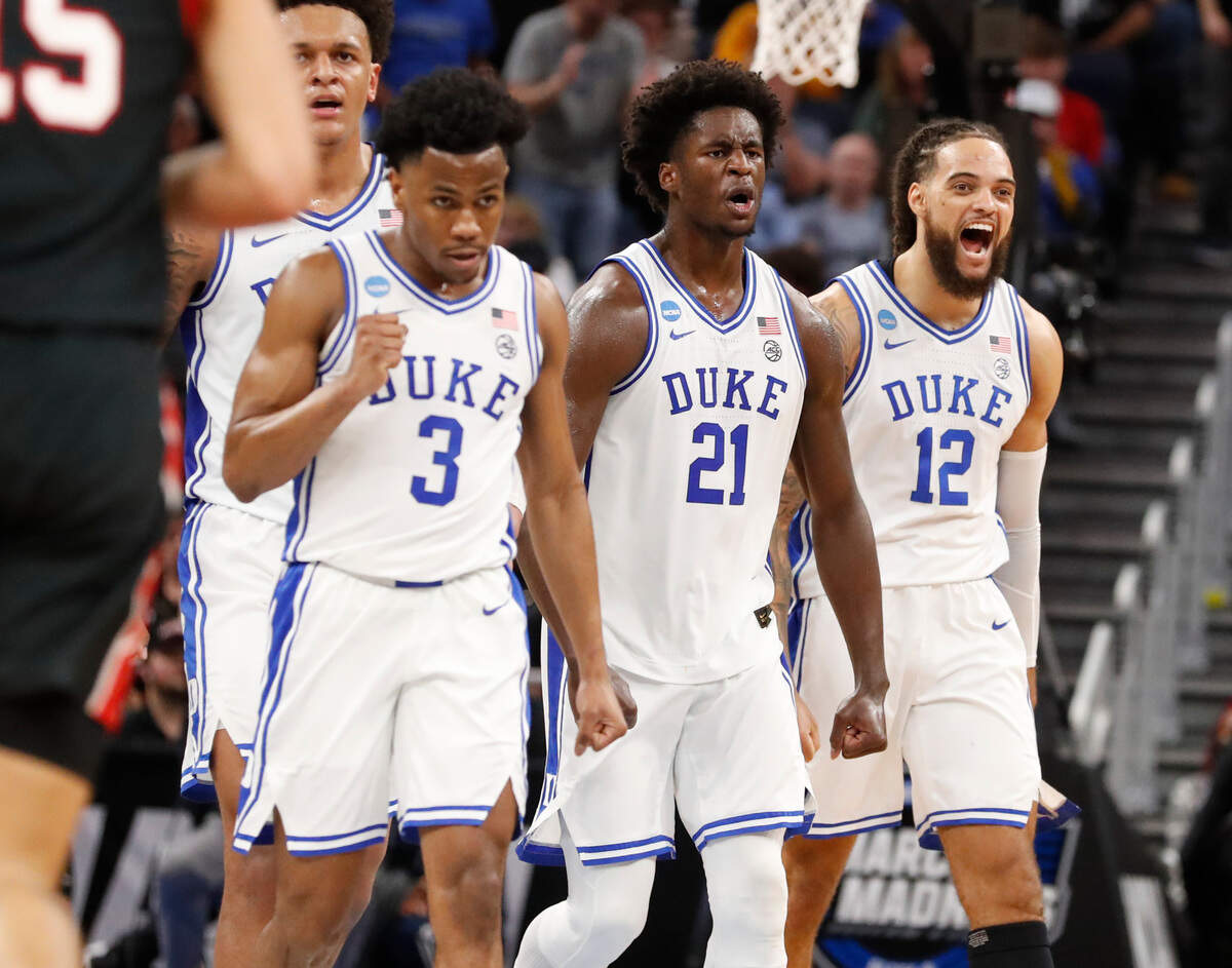 Duke’s Paolo Banchero (5), Jeremy Roach (3), AJ Griffin (21) and Theo John (12) celebrate as they head to their bench during a timeout in the second half of Duke’s 78-73 victory over Texas Tech in the Sweet 16 round of the NCAA Tournament at the Chase Center in San Francisco, Calif., Thursday, March 24, 2022.
