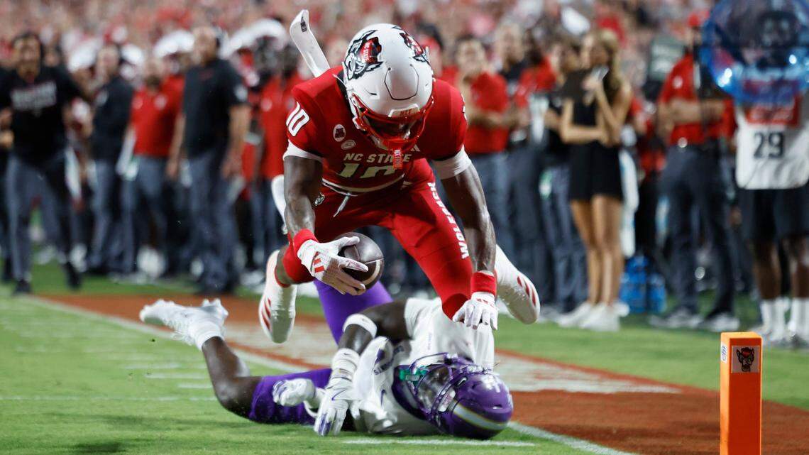 N.C. State wide receiver KC Concepcion (10) dives in for a five-yard touchdown reception during the first half of N.C. State’s game against Western Carolina at Carter-Finley Stadium in Raleigh, N.C., Thursday, August 29, 2024.