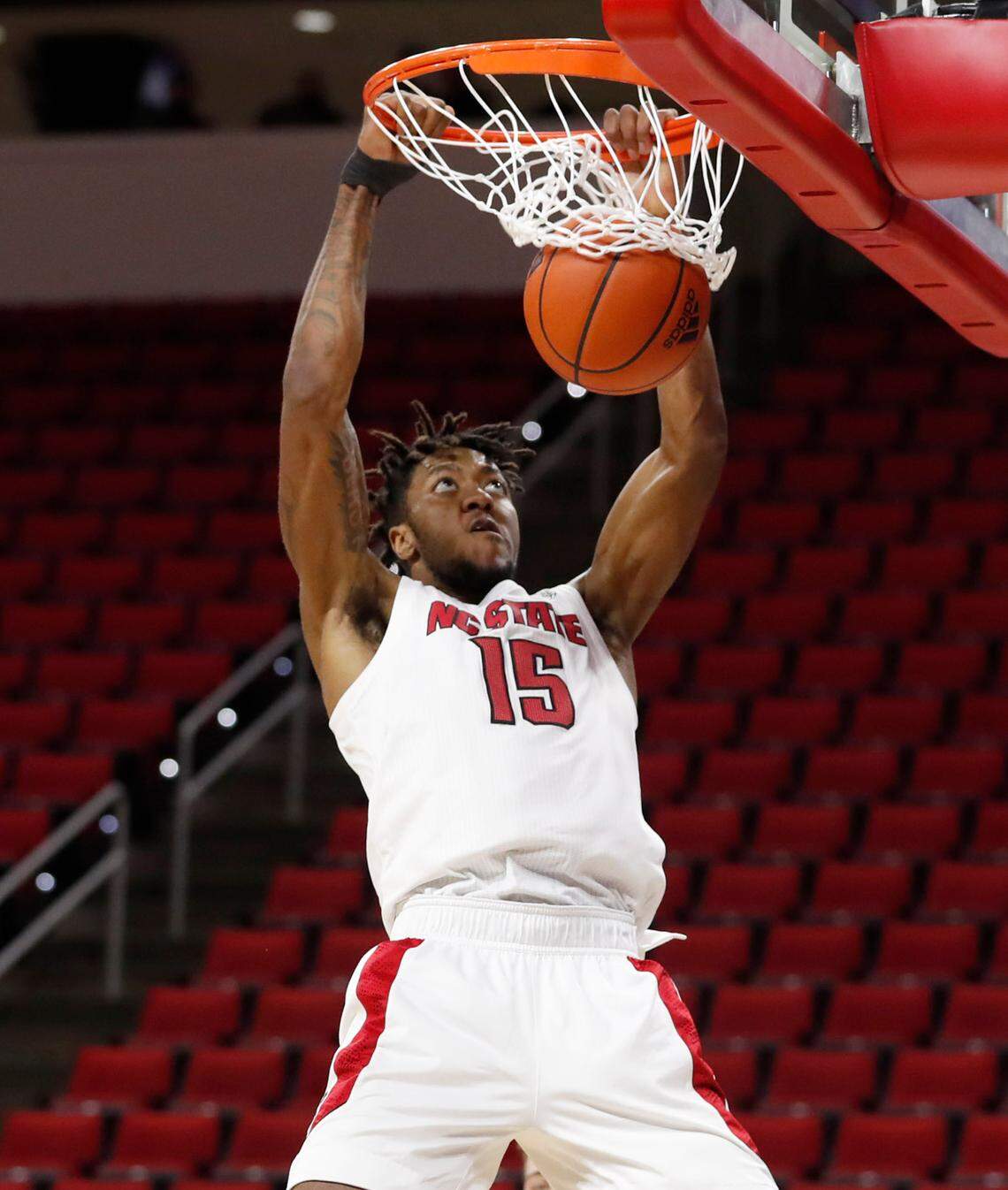 N.C. State’s Manny Bates (15) slams in two during the second half of N.C. State’s 69-50 victory over Campbell at PNC Arena in Raleigh, N.C., Saturday, Dec. 19, 2020.