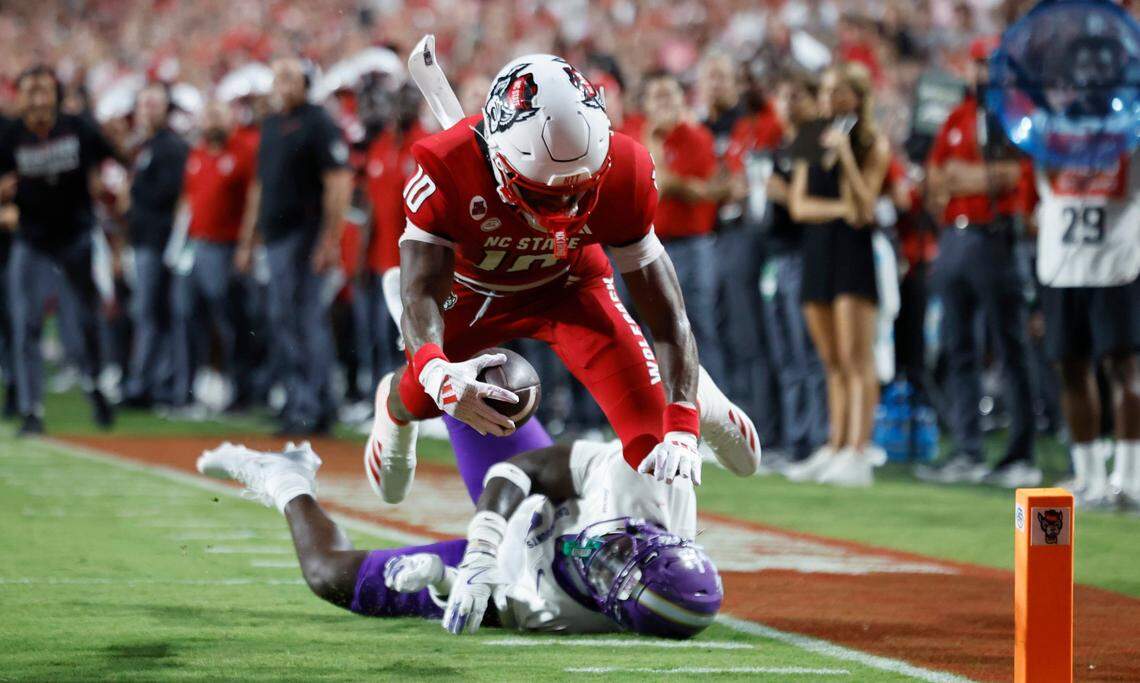 N.C. State wide receiver KC Concepcion (10) dives in for a five-yard touchdown reception during the first half of N.C. State’s game against Western Carolina at Carter-Finley Stadium in Raleigh, N.C., Thursday, August 29, 2024.