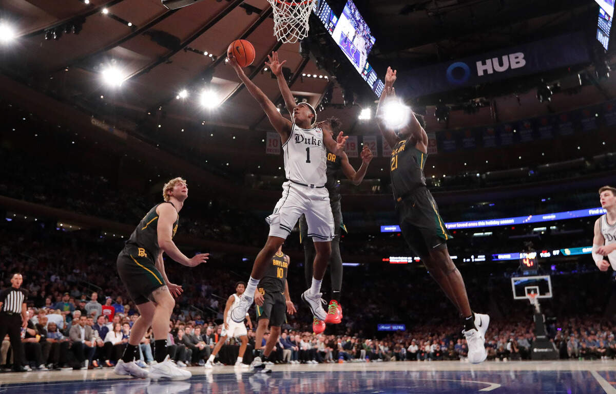 Duke’s Caleb Foster (1) drives to the basket past Baylor’s Ja’Kobe Walter (4) during Duke’s 78-70 victory over Baylor at Madison Square Garden in New York City Wednesday, Dec. 20, 2023.