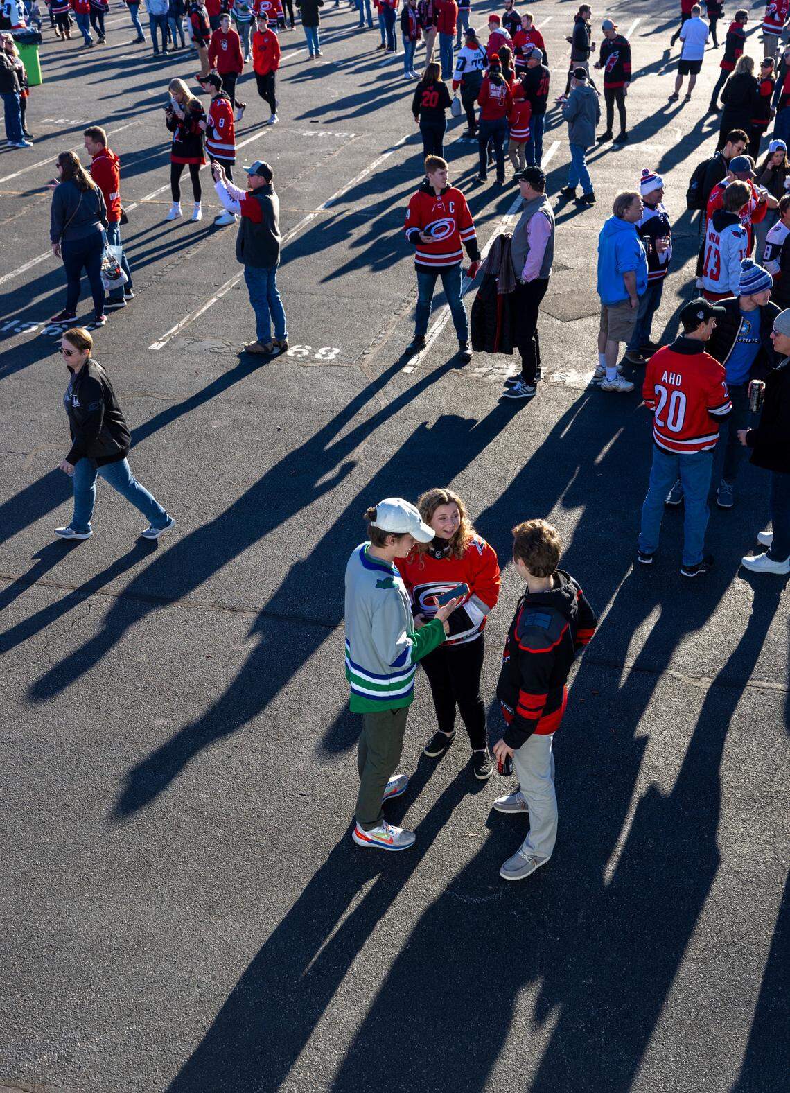 Visitors to the Fan Fest gather in the parking lot of PNC Arena prior to the Stadium Series game between the Washington Capitals and the Carolina Hurricanes on Saturday, February 18, 2022 at Carter-Finley Stadium in Raleigh, N.C.