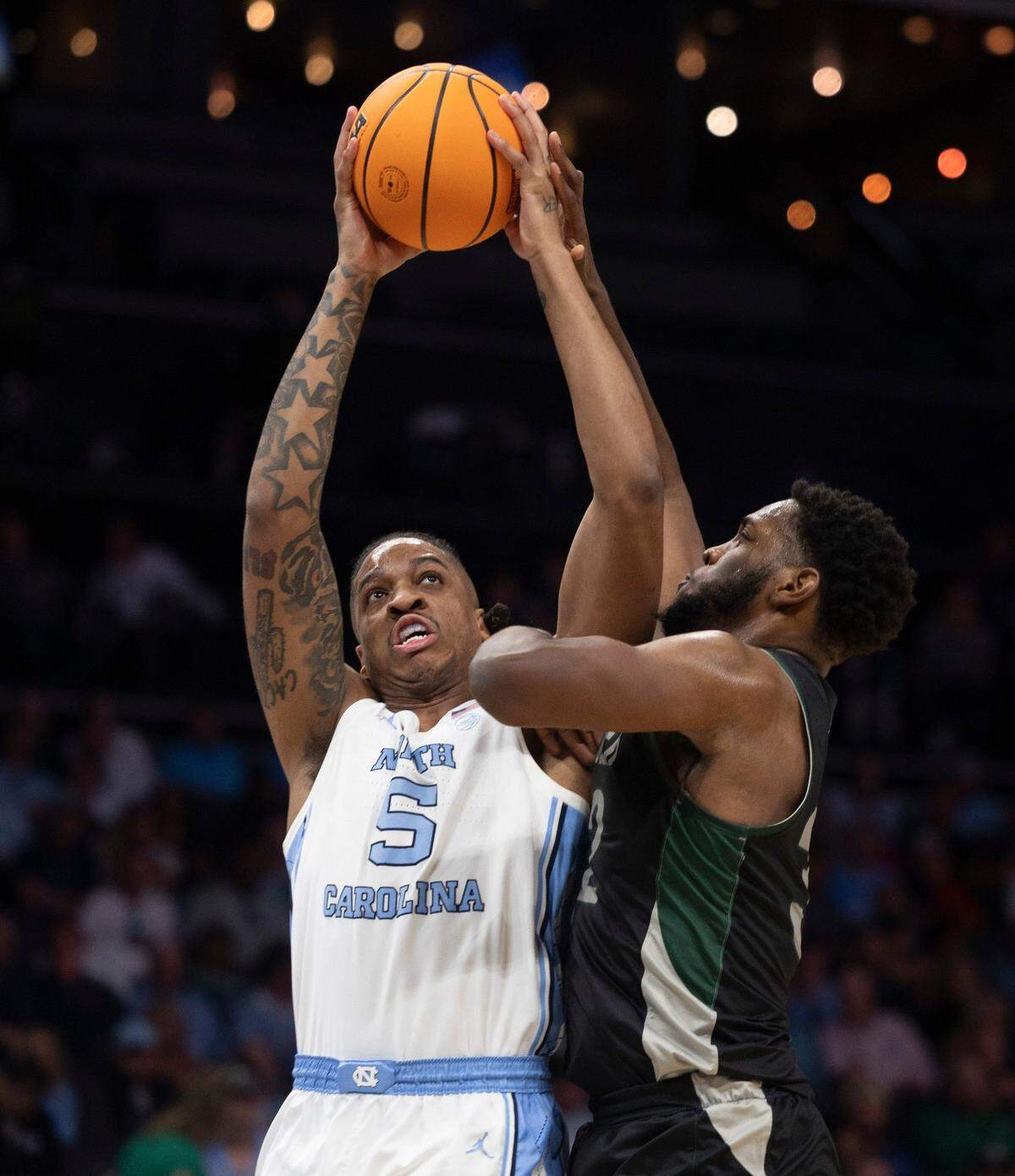 North Carolina’s Armando Bacot (5) puts up a shot against Wagner’s Keyontae Lewis (32) in the first half on Thursday, March 21, 2024 during the NCAA Tournament at Spectrum Center in Charlotte, N.C.