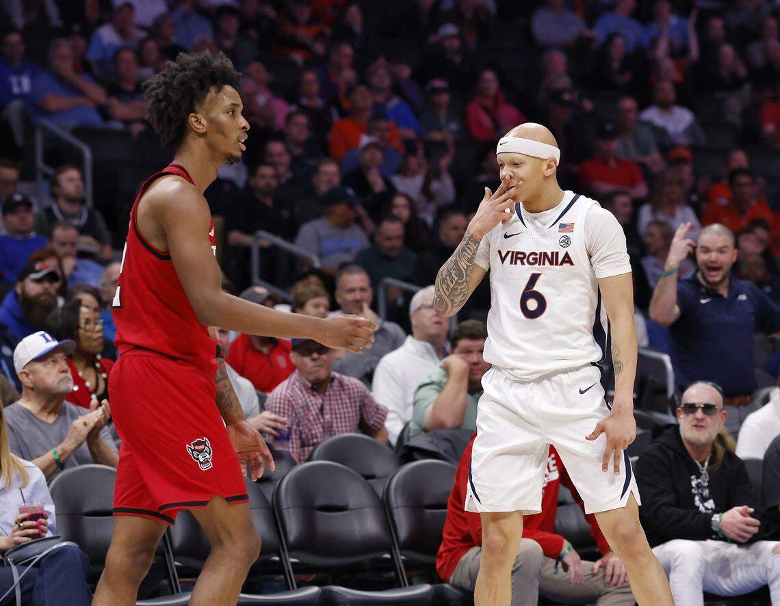 Virginia's Jacari White reacts after knocking down a three-point basket during the second half of the Cavaliers’ 81-74 win over N.C. State in the ACC Tournament quarterfinals on Thursday, March 12, 2026, at the Spectrum Center in Charlotte, N.C. 