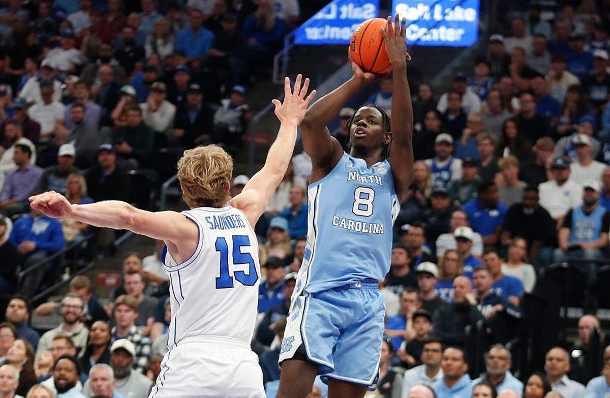 Caleb Wilson (8) of UNC shoots a 3-pointer over Richie Saunders of BYU during the second half of their exhibition game at the Delta Center on October 24, 2025 in Salt Lake City, Utah.