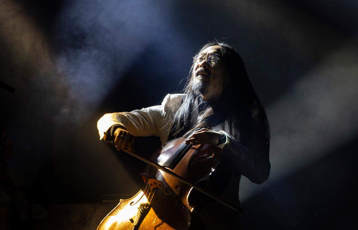 Cellist Joe Kwon performs with The Avett Brothers during their New Year’s Eve show, Dec. 31, 2023.