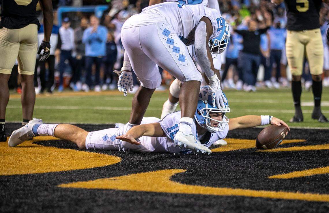 North Carolina quarterback Drake Maye (10) reacts after scoring on a five-yard run to give the Tar Heels a 33-28 lead in the third quarter against Wake Forest on Saturday, November 12, 2022 at Truist Field in Winston-Salem, N.C.