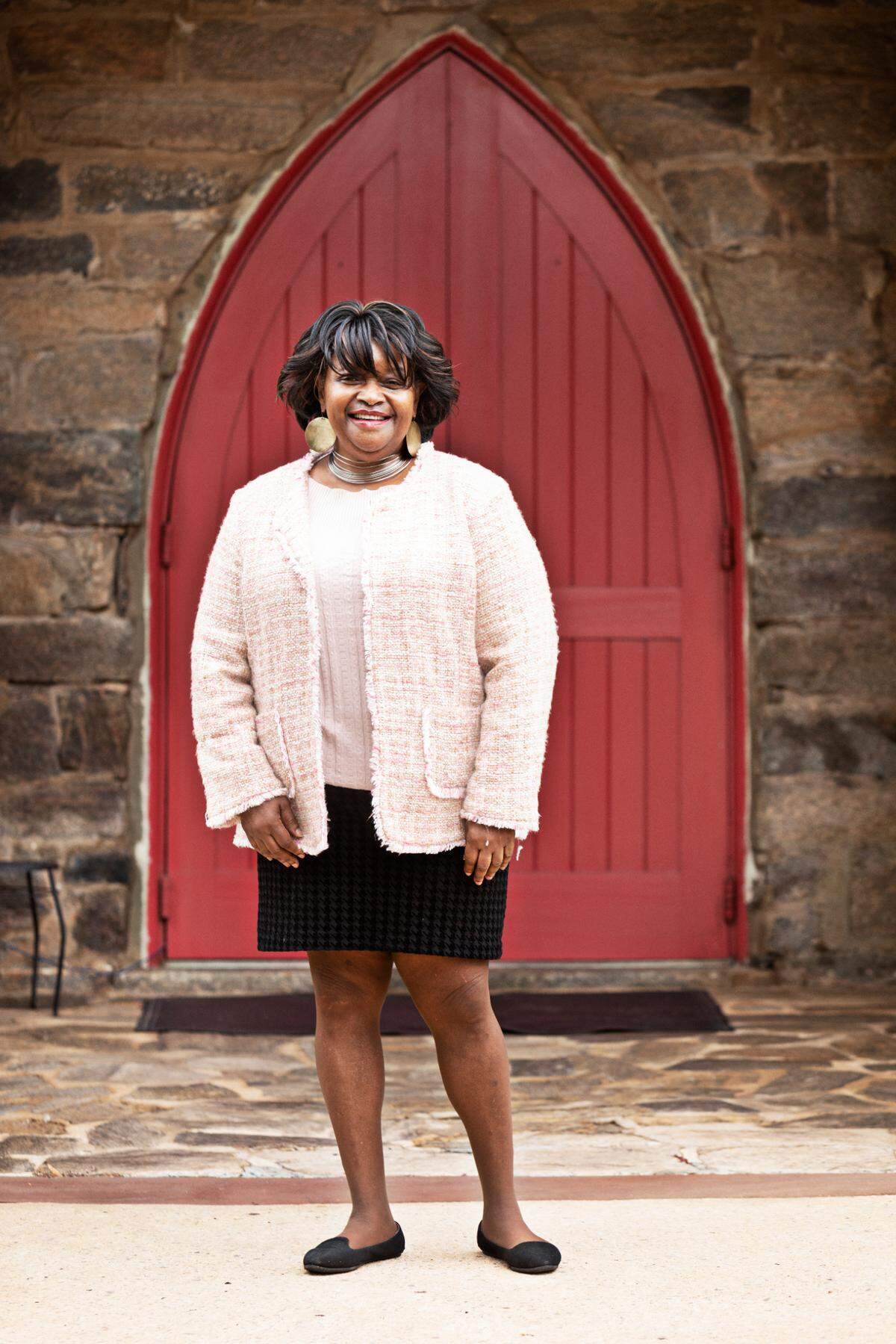 Octavia Rainey outside of St. Augustine’s College’s chapel in Raleigh on Thursday, Feb. 3, 2022. Henry Beard Delany, the father of Sadie and Bessie Delany, finished a degree at St. Augustine’s College, taught there for decades and built the campus chapel and St. Agnes’ Hospital.