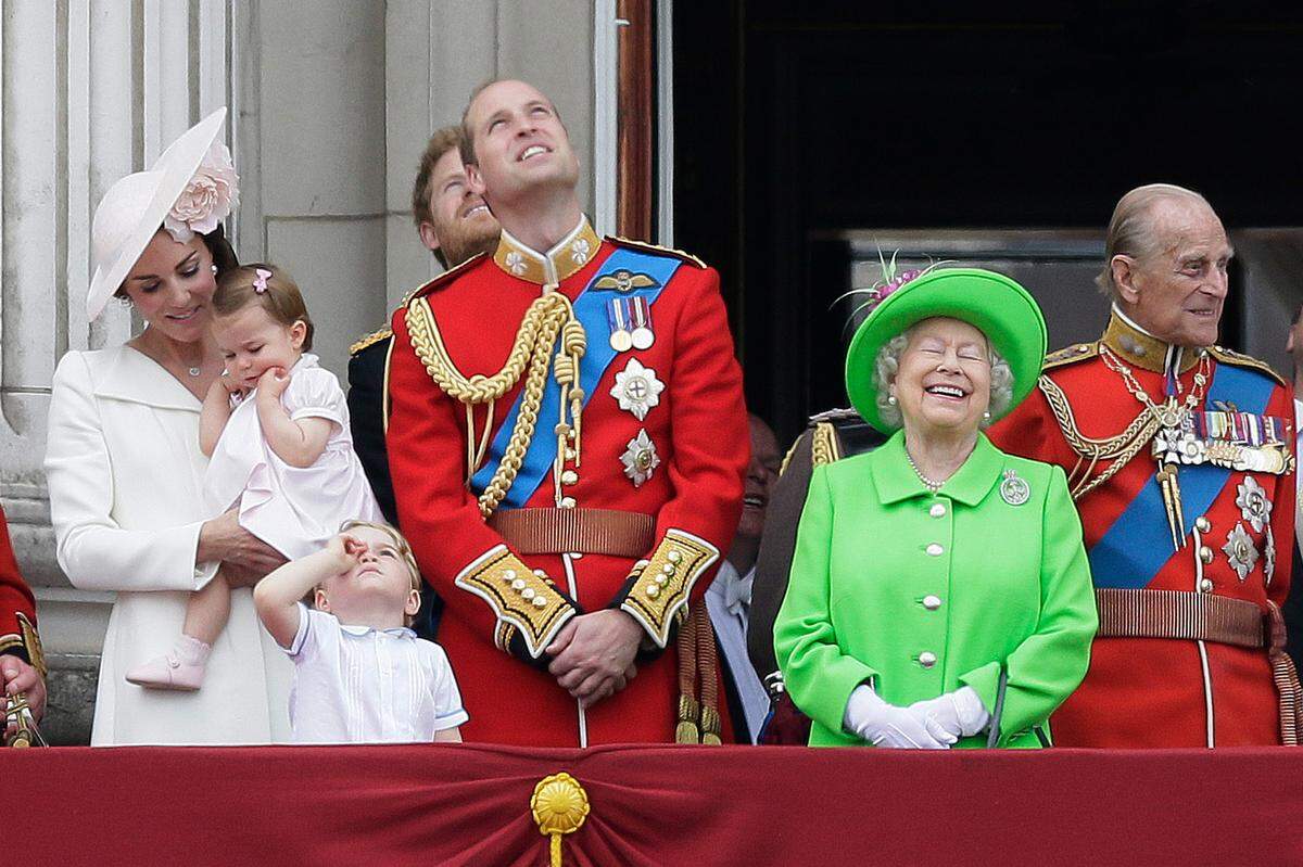 Britain’s Queen Elizabeth II smiles with Prince Philip, right, Prince William, centre, his son Prince George, front, and Kate, Duchess of Cambridge holding Princess Charlotte, left, on the balcony during the Trooping The Colour parade at Buckingham Palace, in London, Saturday, June 11, 2016. Hundreds of soldiers in ceremonial dress have marched in London in the annual Trooping the Colour parade to mark the official birthday of Queen Elizabeth II. The Trooping the Colour tradition originates from preparations for battle, when flags were carried or “trooped” down the rank for soldiers to see.