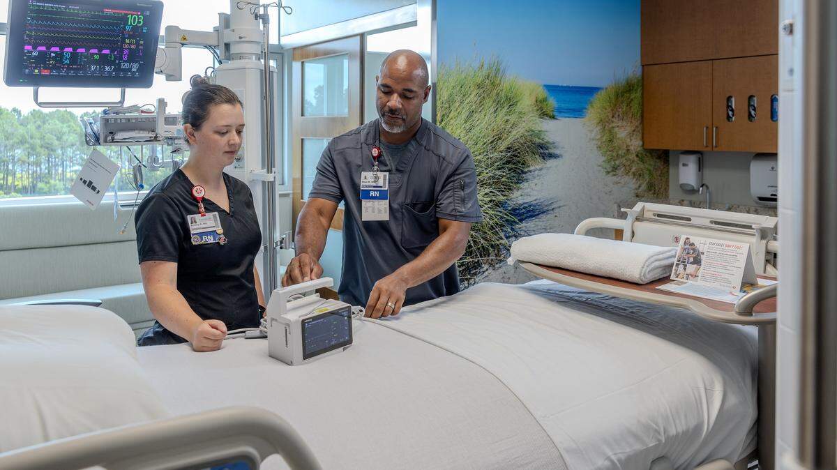 Physicians work inside a room at the new intensive care unit at WakeMed North Hospital.