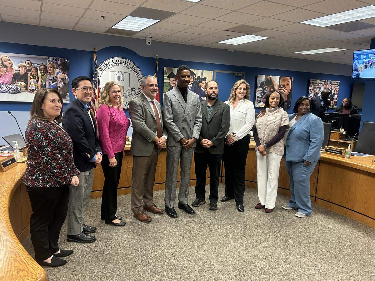 Group photo of Wake County school board on Dec. 2, 2025: Jennifer Job, Wing Ng, Lynn Edmonds, Chris Heagarty, Tyler Swanson, Sam Hershey, Cheryl Caulfield, Christina Gordon and Toshiba Rice.