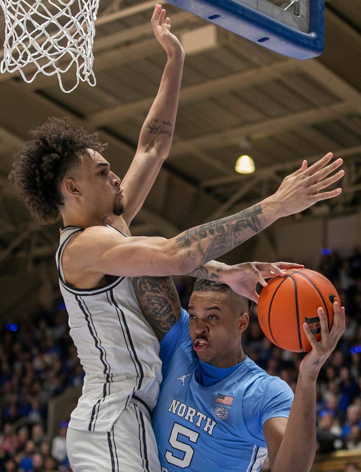 Duke’s Dereck Lively II (1) defends North Carolina’s Armando Bacot (5) in the second half on Saturday, February 4, 2023 at Cameron Indoor Stadium in Durham, N.C.