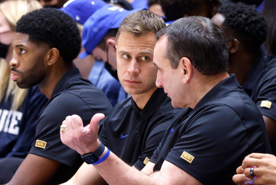 Duke assistant coach Jon Scheyer talks with head coach Mike Krzyzewski during Duke’s exhibition game against Winston-Salem State University at Cameron Indoor Stadium in Durham, N.C., Saturday, Oct. 30, 2021.