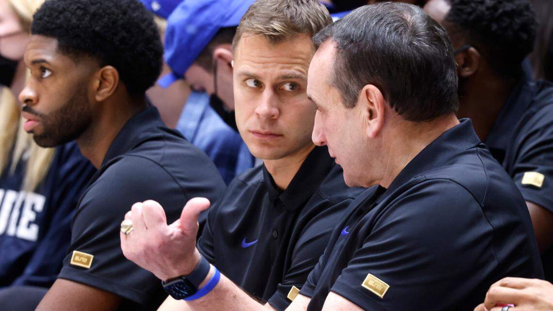 Duke assistant coach Jon Scheyer talks with head coach Mike Krzyzewski during Duke’s exhibition game against Winston-Salem State University at Cameron Indoor Stadium in Durham, N.C., Saturday, Oct. 30, 2021.