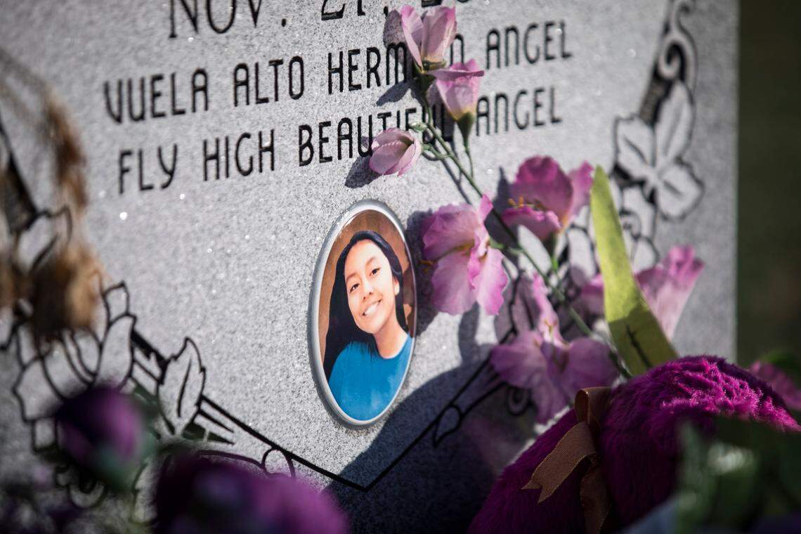 A photograph of Hania Aguilar was included on her headstone, pictured here on Tuesday, April 23, 2019. The community raised the funds to pay for the headstone, which is now surrounded by purple and pink decorations.