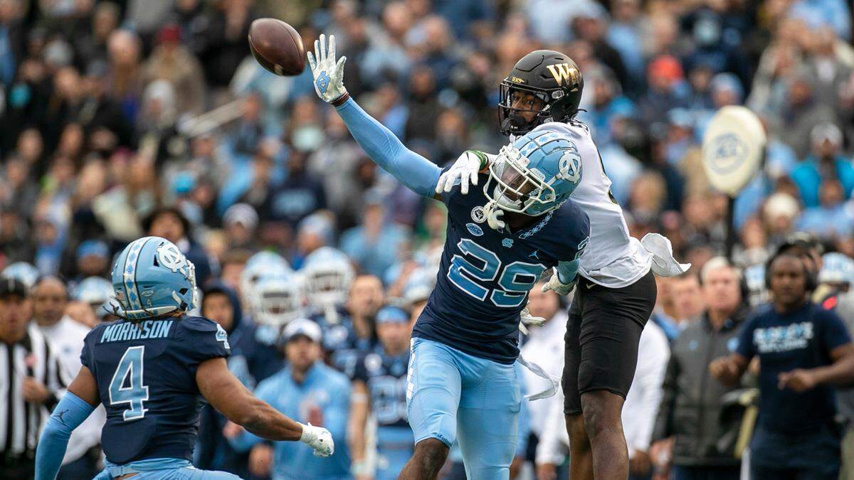 North Carolina’s Storm Duck (29) breaks up a pass intended for Wake Forest’s A.T. Perry (9) on fourth down, turning the ball over to North Carolina and securing their victory on Saturday, November 6, 2021 at Kenan Stadium in Chapel Hill, N.C.
