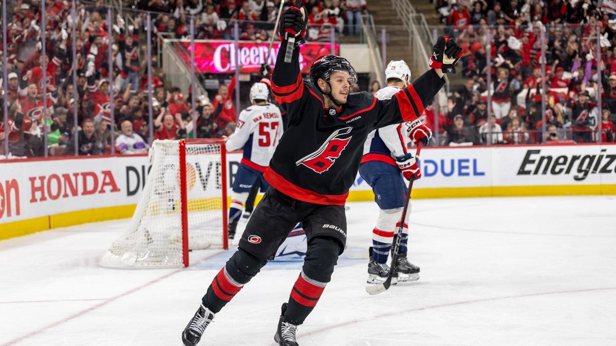 Carolina Hurricanes center Jesperi Kotkaniemi (82) reacts after a goal by teammate Shaye Gostisbehere (04) in the first period, to take a 1-0 lead against the Washington Capitals during Game 4 of their series on Monday, May 12, 2025 at Lenovo Center in Raleigh, N.C.
