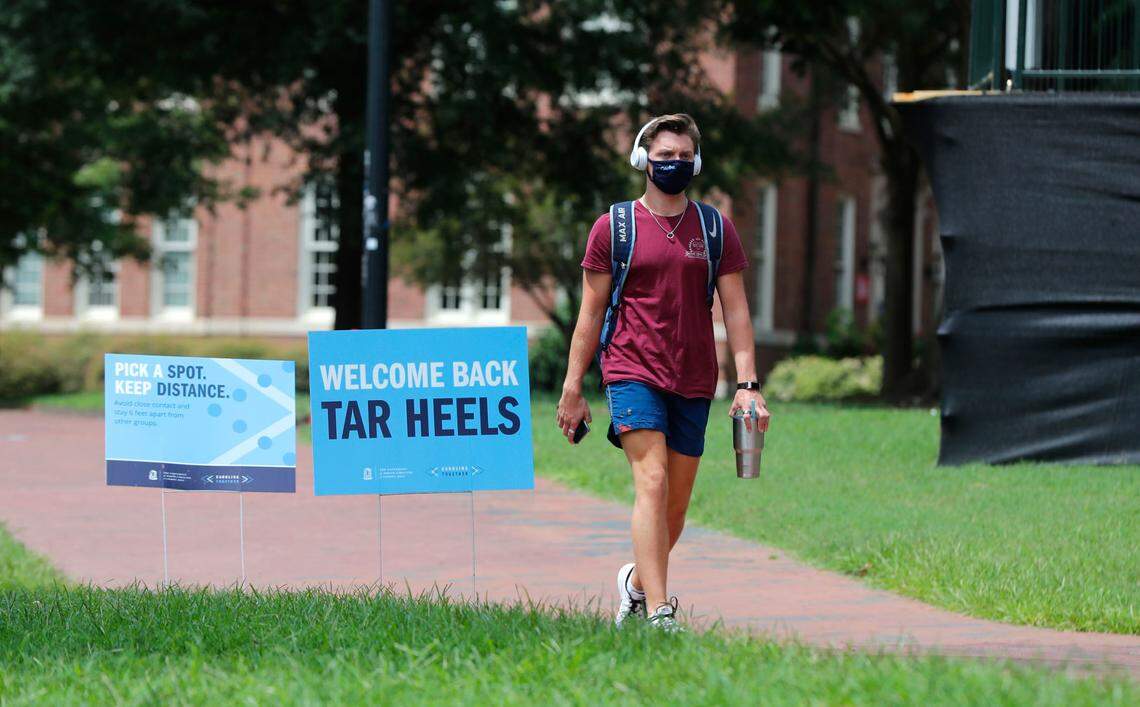 People walk around the campus of UNC in Chapel Hill, N.C., Tuesday, August 18, 2020.