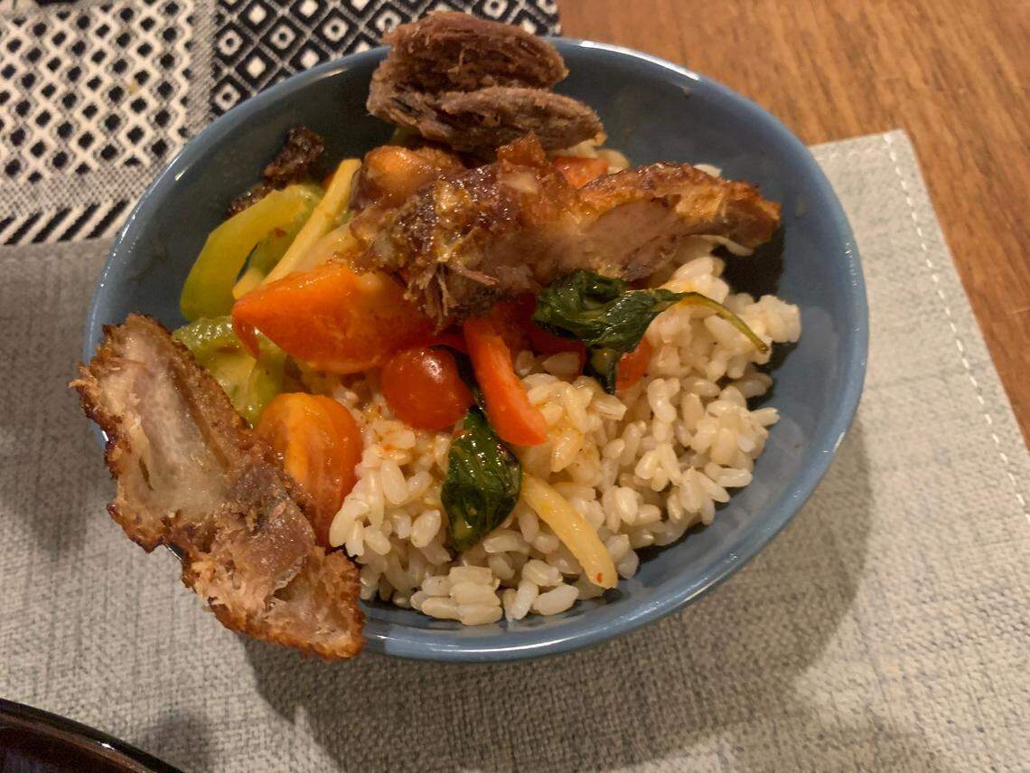 Wasabi, a local favorite restaurant in MacGregor Village in Cary, has been serving a Japanese-Thai twin bill menu since 2003. This roasted duck red curry with brown rice is from the Thai menu.