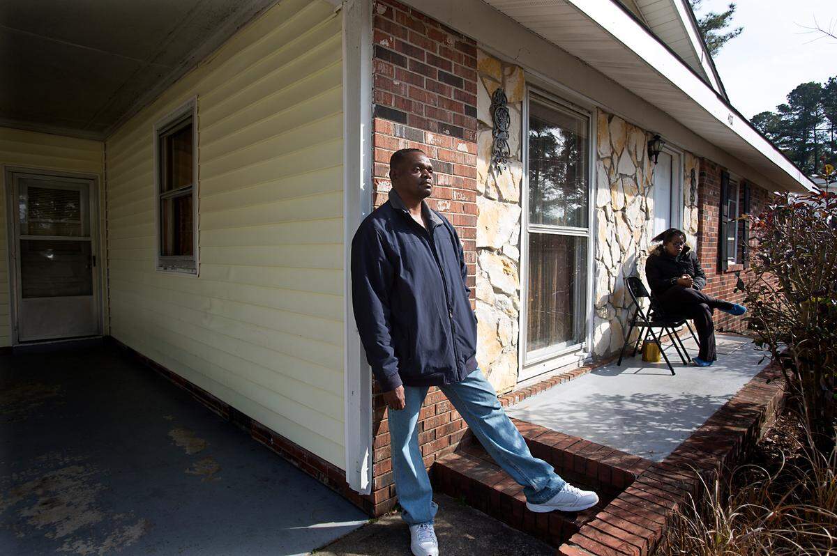Henry McCollum spends time outdoors with his sister, Geraldine Brown, 49, rear, in Fayetteville, N.C. in 2015.