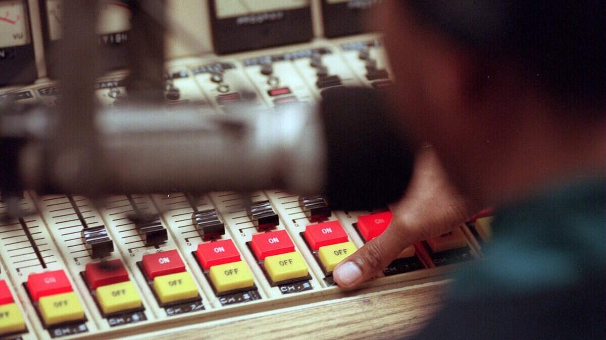 A DJ works the controls of WSHA at Shaw University in Raleigh. The station could go off the air if a proposed sale goes through.