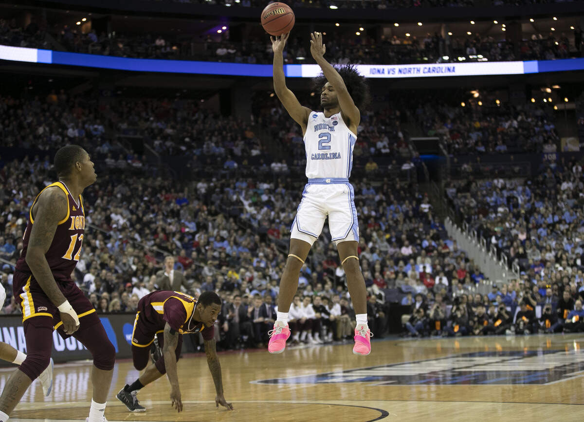 North Carolina’s Coby White (2) launches a shot over Iona’s Rickey McGill (0) and Tajuan Agee (12) during the second half on Friday, March 22, 2019 at Nationwide Arena in Columbus, Ohio.