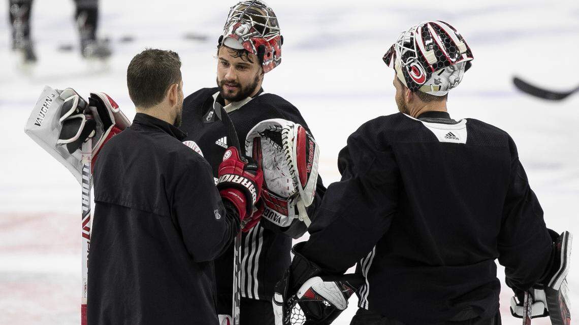 Carolina Hurricanes goalies coach Mike Bales talks with Petr Mrazek (34) and Curtis McElhinney (35) during practice on Monday, May 6, 2019 at PNC Arena in Raleigh, N.C. Mrazek returned to the ice on Monday after being out a week for a injury.