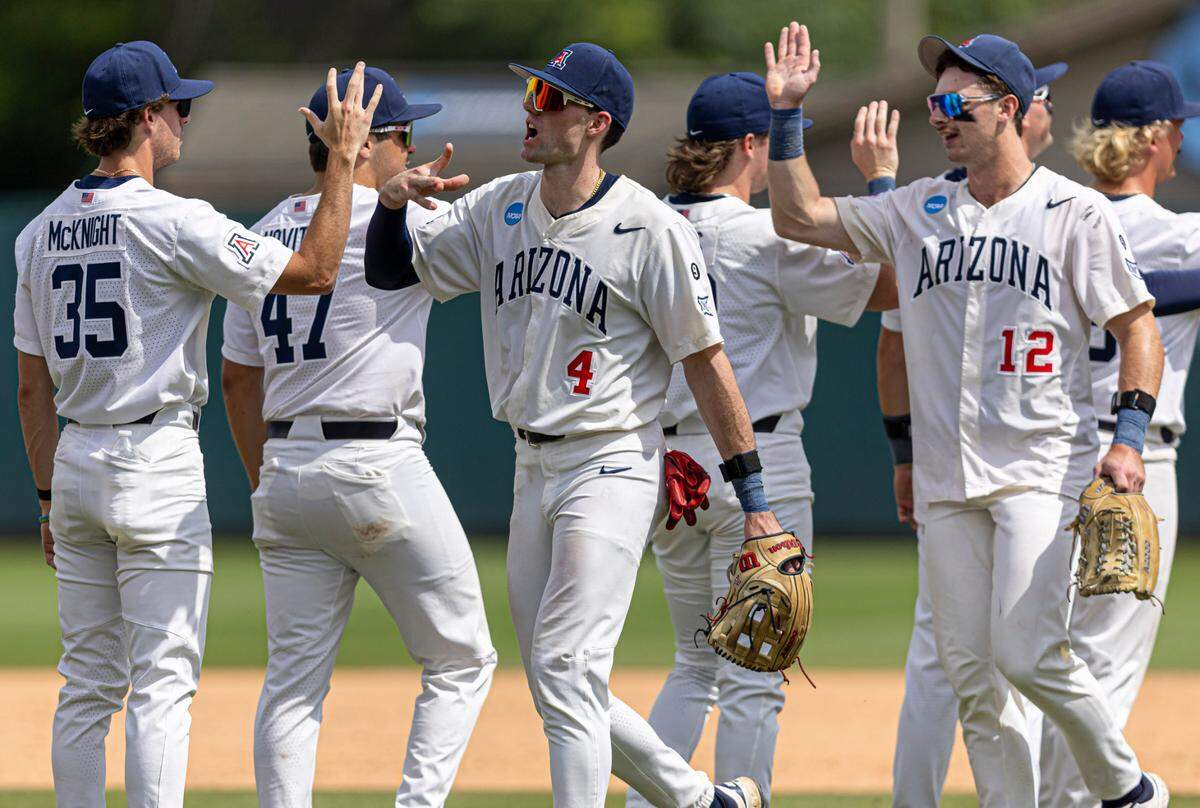 Arizona right fielder Brendan Summerhill (4) celebrates the Wildcats’ 10-8 victory over North Carolina with teammates in the NCAA Super Regional on Saturday, June 7, 2025 at Boshamer Stadium in Chapel Hill, N.C. With the victory Arizona forces a third and deciding game in the series for Sunday, with the winner advancing to the College World Series.