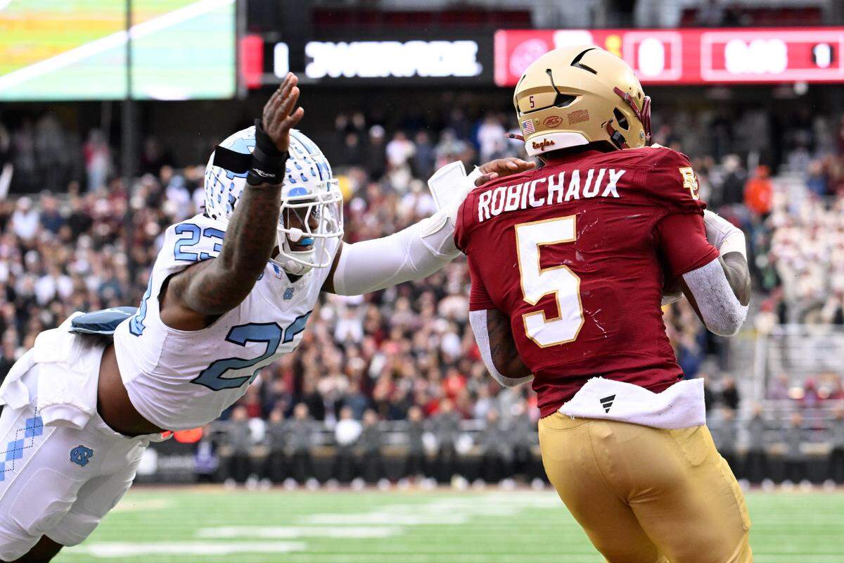 North Carolina Tar Heels linebacker Power Echols (23) tackles Boston College Eagles running back Kye Robichaux (5) during the first half at Alumni Stadium.